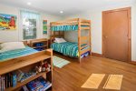Kids` room with bunk bed, trundle bed and lots of games